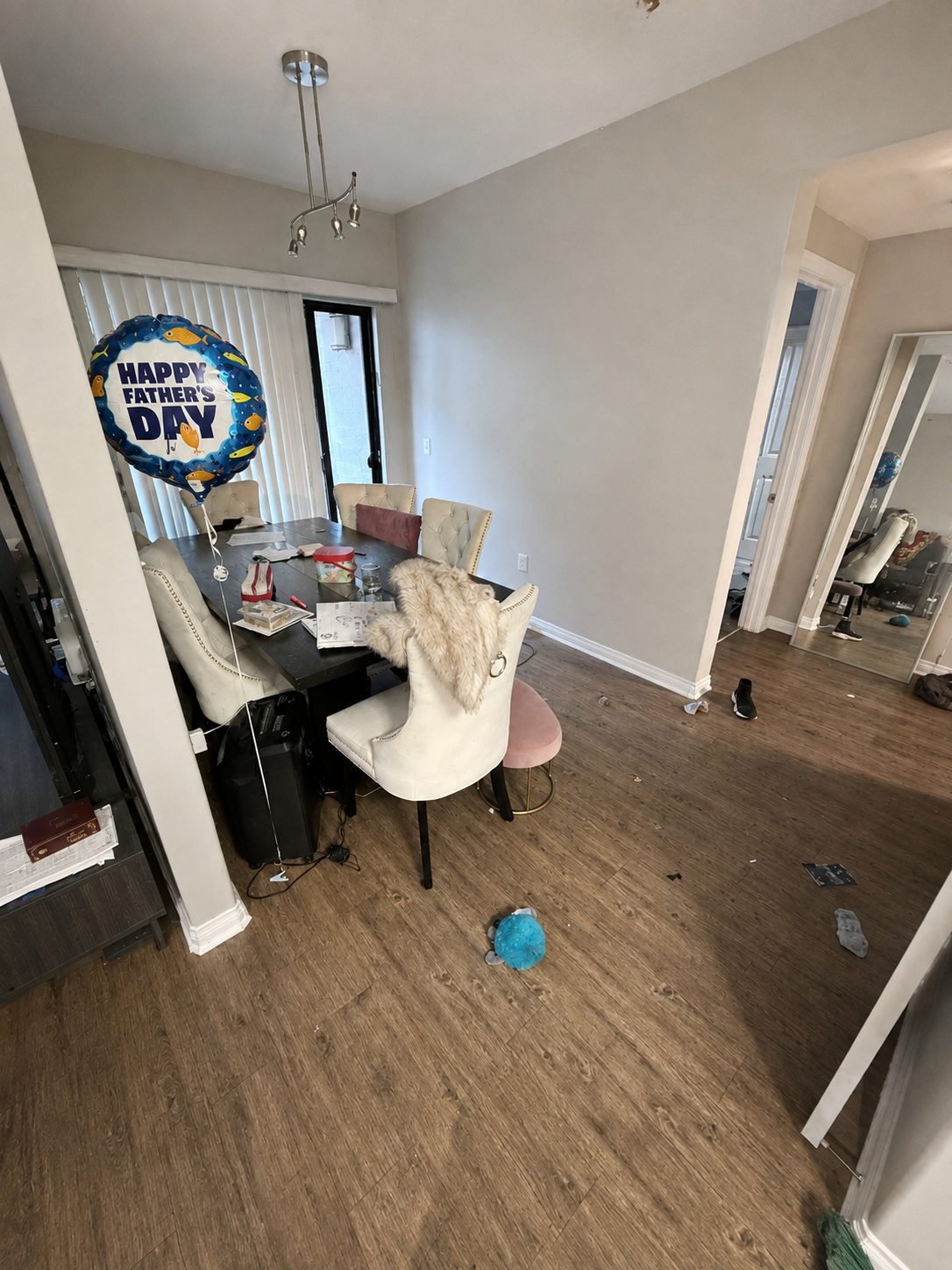 A cluttered dining room before Bergamot. cleaned it